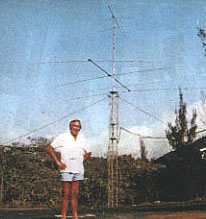 Ted, ZD8TC, standing next to his tower
