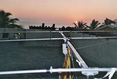 Neil's antenna on the flat roof at 20m AGL/ASL and 30m from the shore, as the sun was setting over the ocean (peak propagation time) beaming ZL/VK.